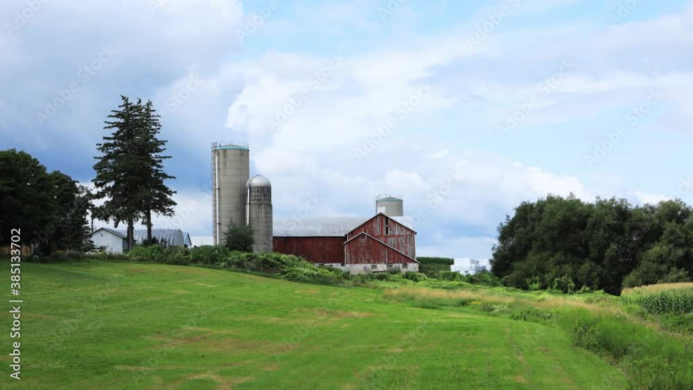 Timelapse of country scene with barn on beautiful day 4K Timelapse of country scene with barn on beautiful day 4K
