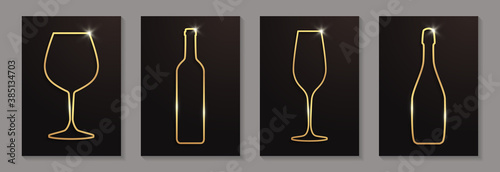 Set of shiny golden wine and champagne glasses and bottles on a black background.