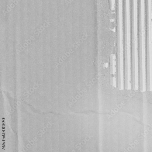 White vintage rough sheet of carton. Recycled environmentally friendly cardboard paper texture. Simple gray minimalist papercraft background.