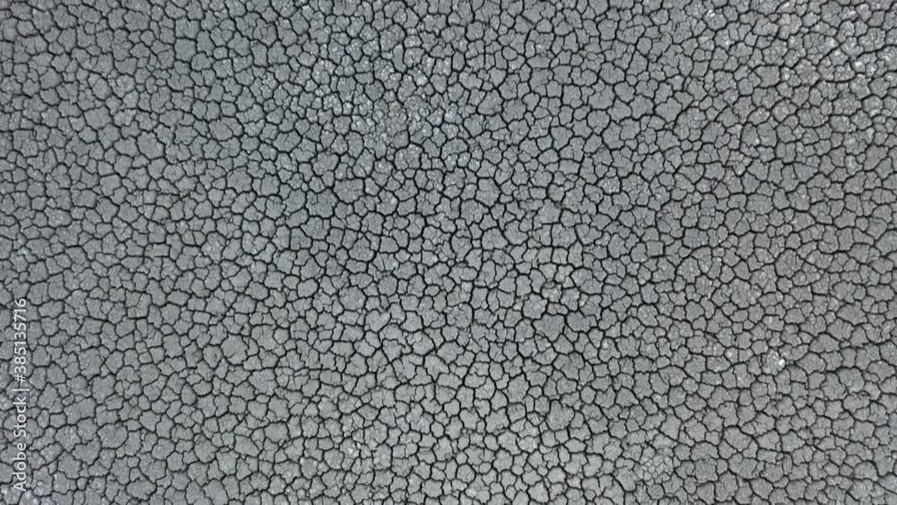 Cracked earth, cracked soil. texture of grungy dry cracking parched earth. Global worming effect. Cracked earth, cracked soil. texture of grungy dry cracking parched earth. Global worming effect.