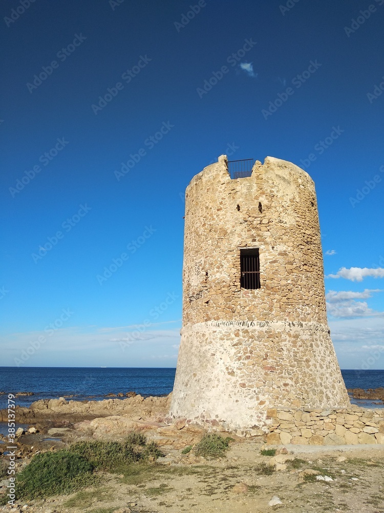 San Giovanni tower against seascape in Sardinia