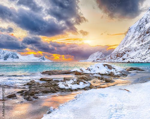 Fabulous winter scenery with Haukland beach during sunset and snowy  mountain peaks near Leknes.