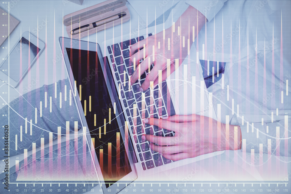 Double exposure of woman hands working on computer and forex graph hologram drawing. Top View. Financial analysis concept. Double exposure of woman hands working on computer and forex graph hologram drawing. Top View. Financial analysis concept.