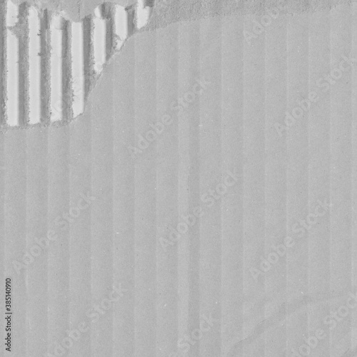 White vintage rough sheet of carton. Recycled environmentally friendly cardboard paper texture. Simple gray minimalist papercraft background. © artistmef