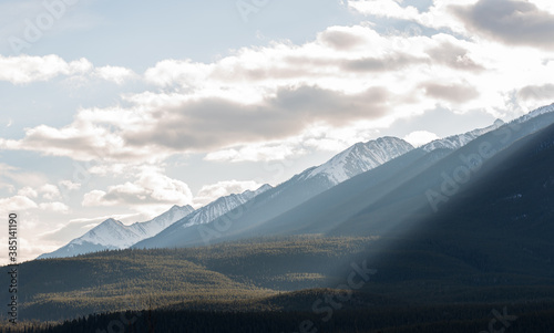 Sunrays passing through mountains between Calgary and Banff, Canada.