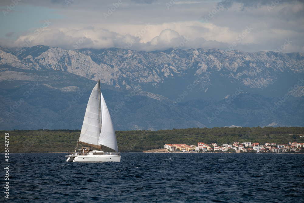 Catamaran sailing on Adriatic sea clos