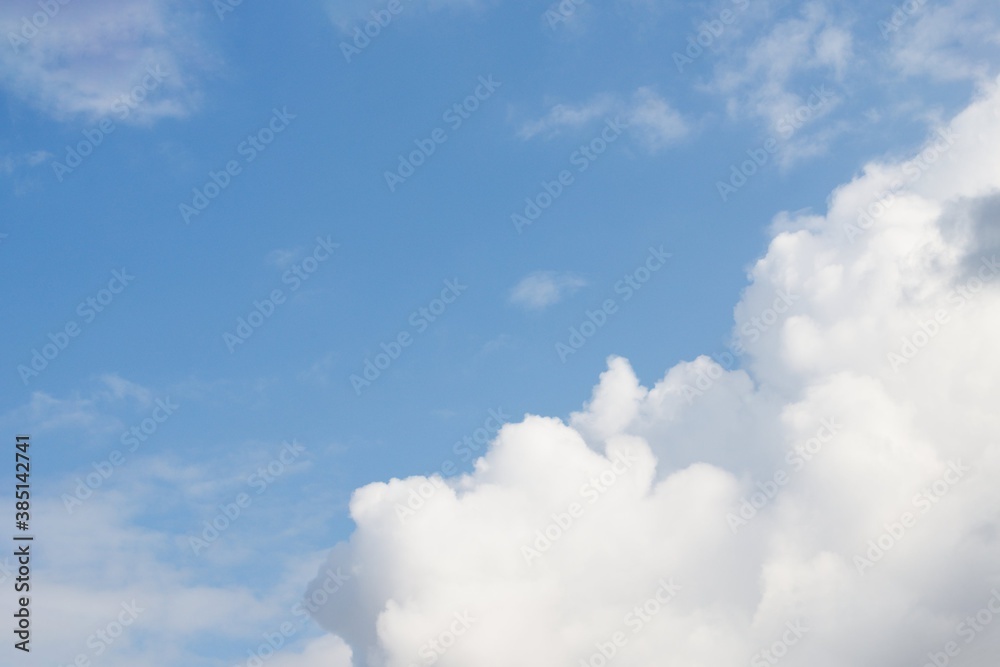 Beautiful white fluffy clouds on a blue sky background Beautiful white fluffy clouds on a blue sky background