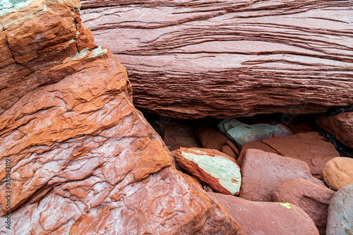 At Cavendish beach, on Canada's Prince Edward Island, the flat red and turquoise sandstone is weathered with ocean salt to create a stunning layered pattern from eons of erosion