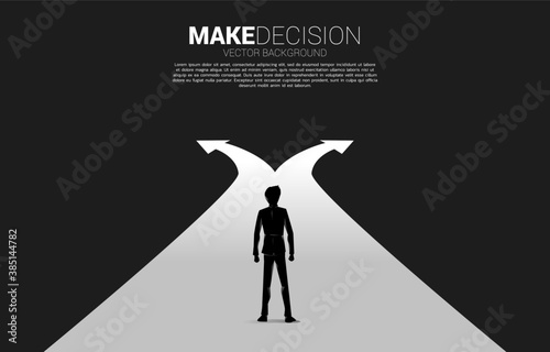 Silhouette of businessman standing at crossroad. Concept of time to make decision in business direction
