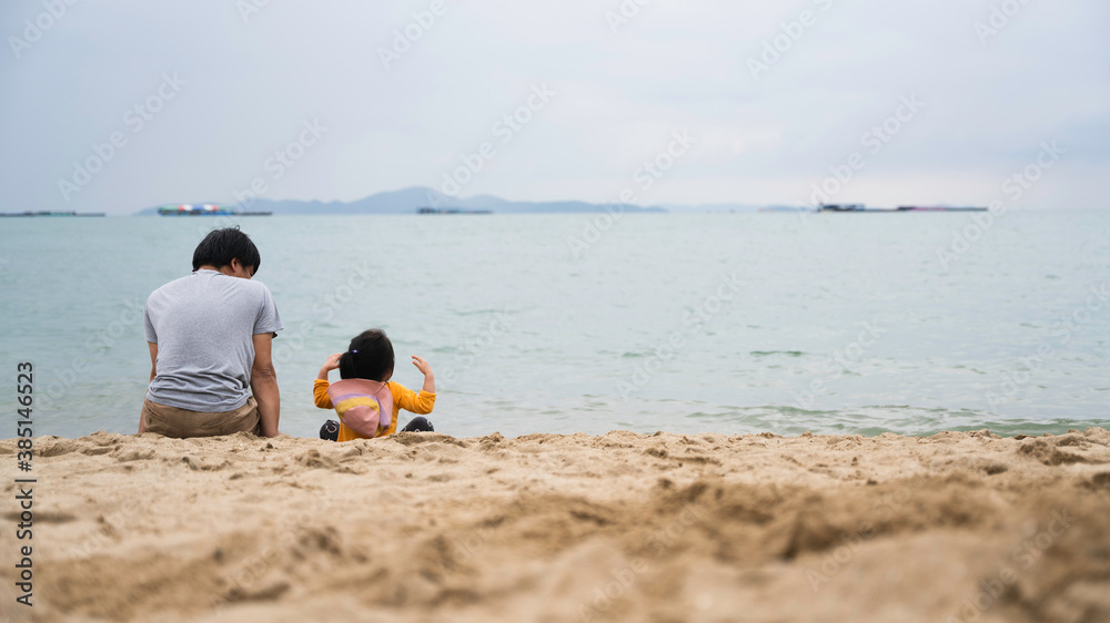 Father and daughter spending time together at the beach during weekend, Mature listening for kid thinking.