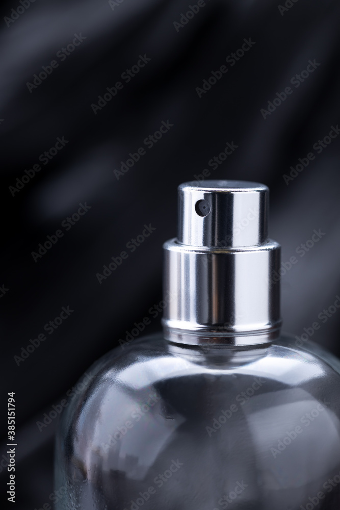 close up macro perfume spray bottle over dark luxury background. gloomy perfume container. copy space close up macro perfume spray bottle over dark luxury background. gloomy perfume container. copy space