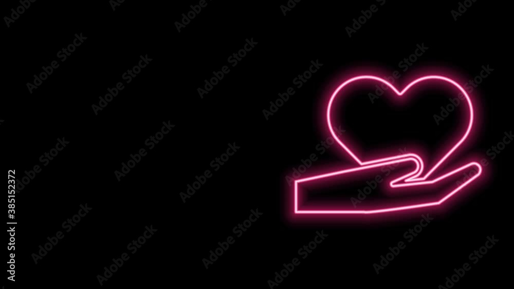 Glowing neon line Heart in hand icon isolated on black background. Hand giving love symbol. Valentines day symbol. 4K Video motion graphic animation
