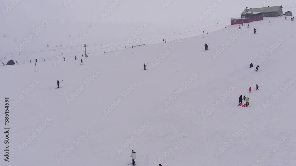 people skiing downhill at Uludag, Turkey people skiing downhill at Uludag, Turkey
