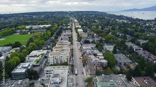 Aerial view of Broadway street in Vancouver with small houses and slow traffic