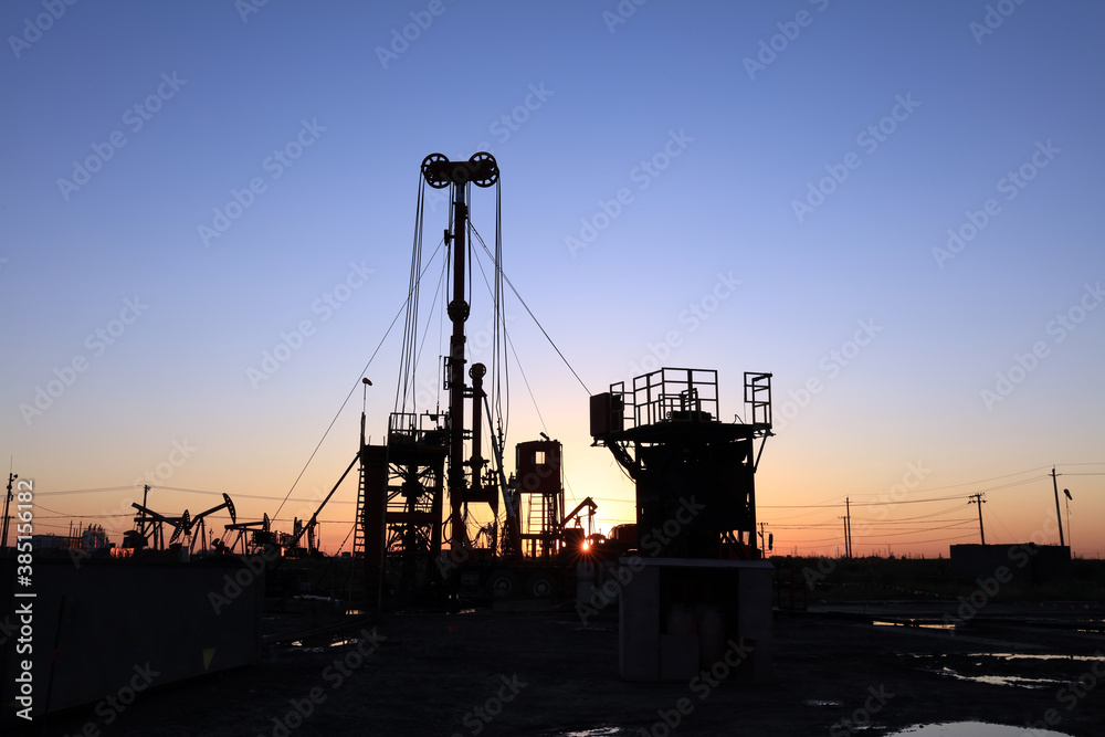 In the evening, oil field site under construction In the evening, oil field site under construction