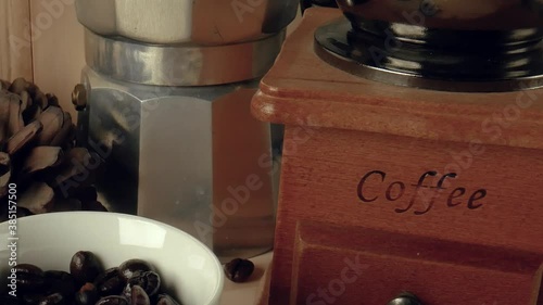 The Coffee beans in white cup on wood table  camera movement.