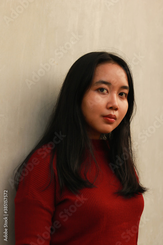 Young beautiful woman wearing red casual t-shirt.