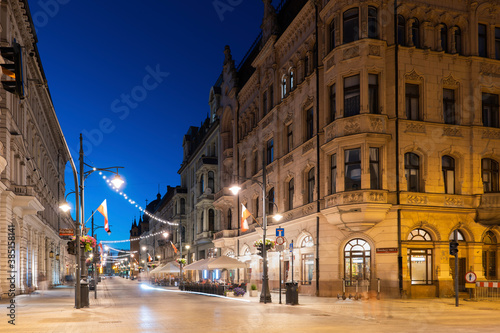 Poland, Lodz, Illuminated Piotrkowska Street at dusk