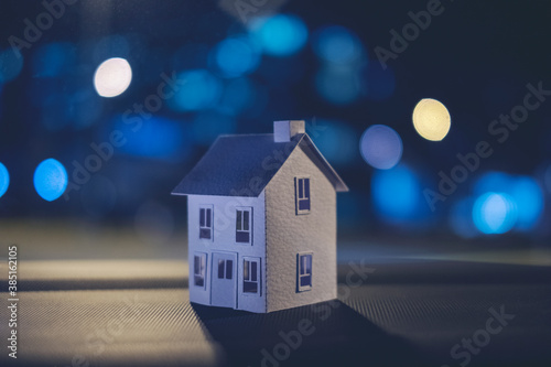 White paper house, blue city lights