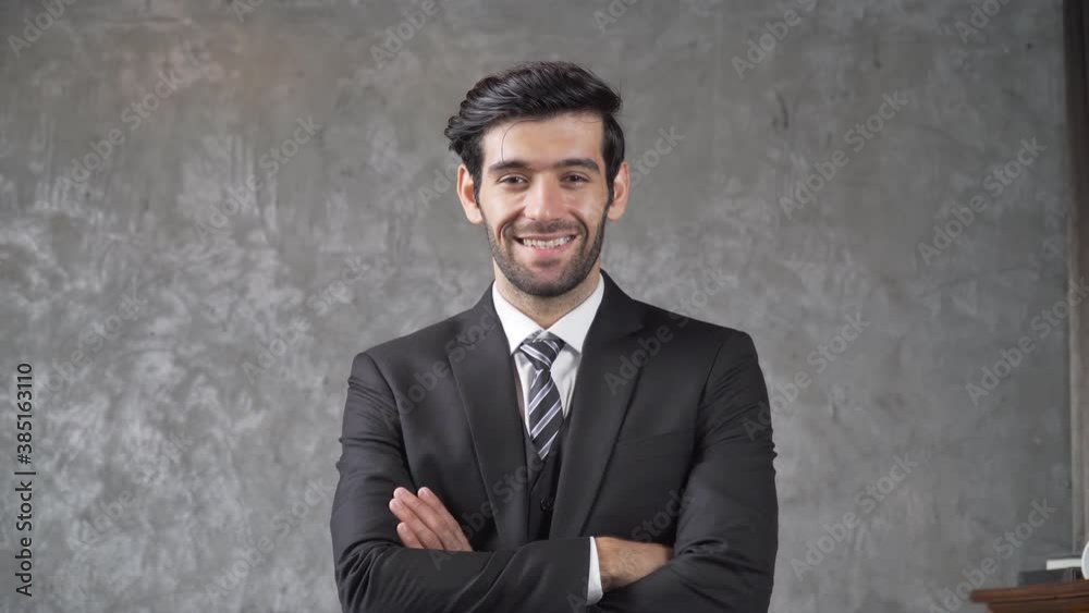B roll of Successful businessman wearing suit crossing arms smiling to camera. Young company leader dreaming of a business success. Confident male ceo executive manager looking and smile with camera. B roll of Successful businessman wearing suit crossing arms smiling to camera. Young company leader dreaming of a business success. Confident male ceo executive manager looking and smile with camera.