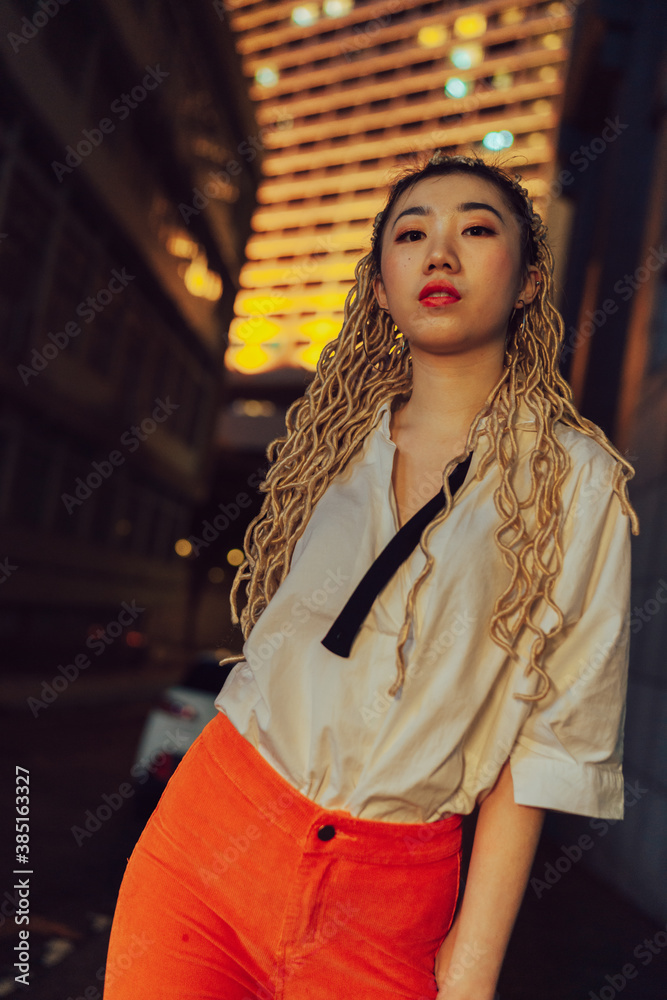 portrait of young asian woman on the street at night portrait of young asian woman on the street at night