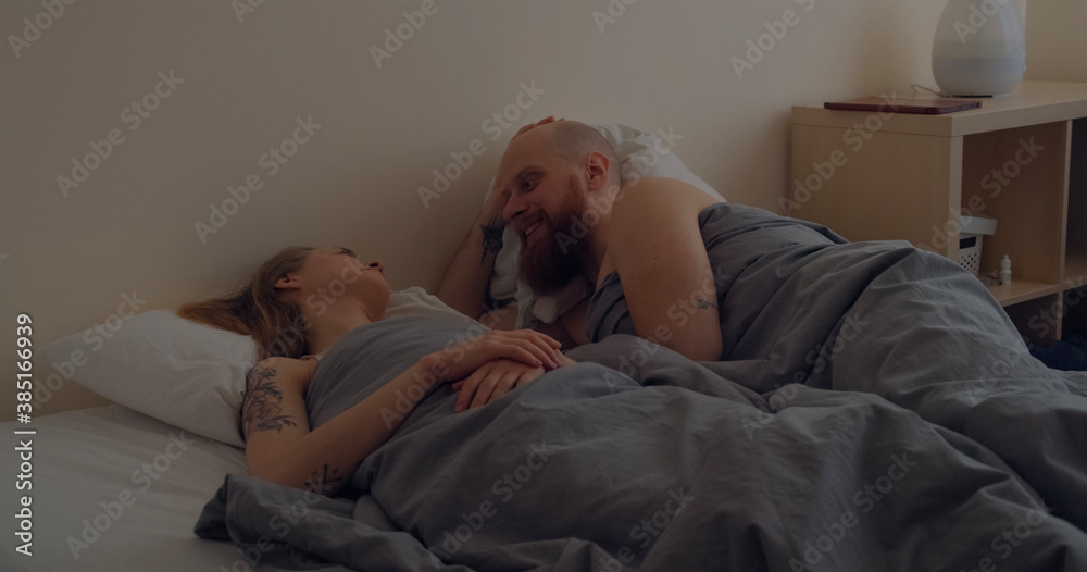 Young couple sleeping in bed together
