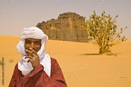 Portrait of a Tuareg man smoking in the Sahara, Algeria, Africa photo