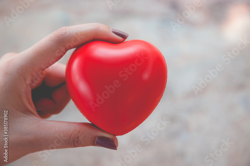 Woman hold red heart