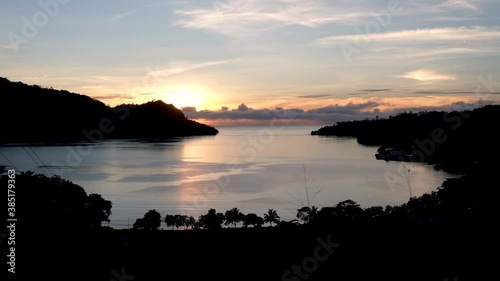 Sunrise Overlooking Pokpok Island + Ocean in Bougainville, Papua New Guinea photo