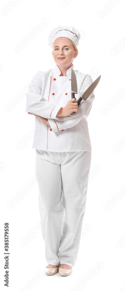 Mature female chef with knives on white background Mature female chef with knives on white background