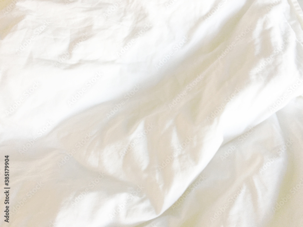 Top view of the crease of an unmade bed sheet in the bedroom after a long night sleep and waking up in the morning Top view of the crease of an unmade bed sheet in the bedroom after a long night sleep and waking up in the morning