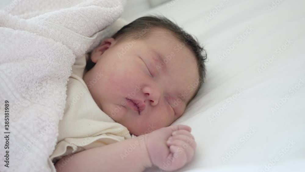 Medicum shot of a newborn mixed asian baby sleeping. Medicum shot of a newborn mixed asian baby sleeping.