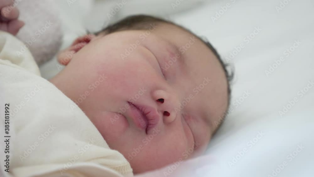 Close up of a Korean mixed new born baby sleeping. Close up of a Korean mixed new born baby sleeping.