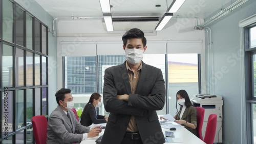 Asian business people wear face mask as new normal in office meeting 