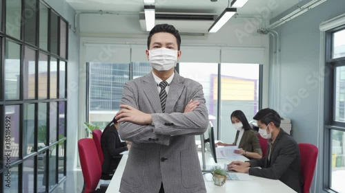 Asian business people wear face mask as new normal in office meeting 