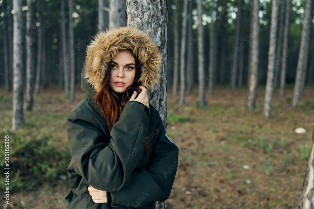Woman in hooded jacket near tree travel nature lifestyle Woman in hooded jacket near tree travel nature lifestyle