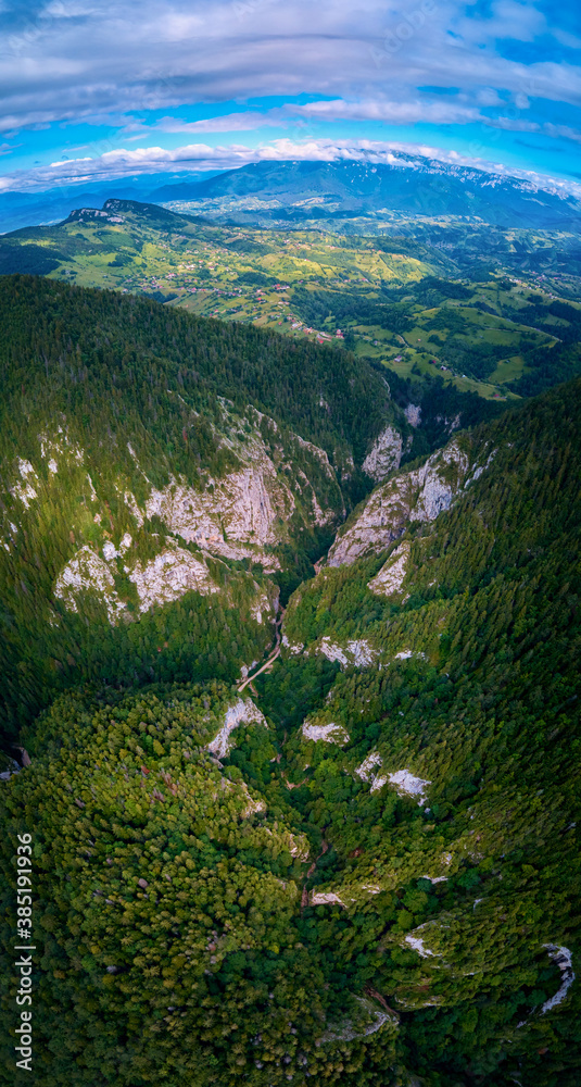 Aerial view above the gorge of Prapastiile Zarnestiuui in Piatra Craiului Mountains, Transylvania, Romania
