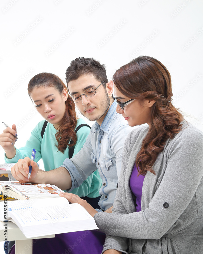 Fototapeta premium Yong south east Asian middle eastern Caucasian youth man woman in casual dress sit stand at table book notebook pen talk study think rad on white background