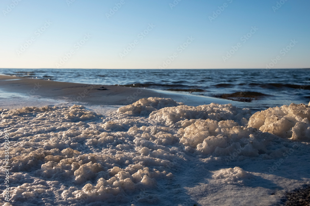 Natural seafoam after storm on the sea. Sea landscape. Natural seafoam after storm on the sea. Sea landscape.