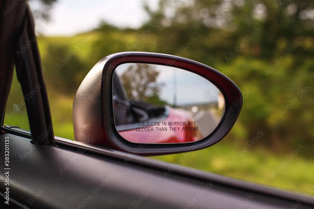 car mirror close up. landscape reflection