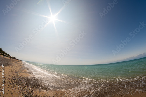 Sea shore with blue shy and white cloud