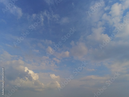 Beautiful white fluffy cloudy sky background 