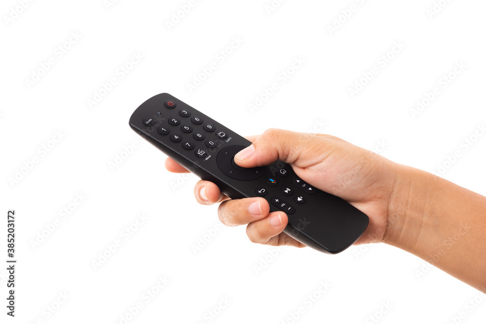 Hand holding television and audio remote control panel, studio shot isolated on over white background, Television wall broadcasting concept Hand holding television and audio remote control panel, studio shot isolated on over white background, Television wall broadcasting concept