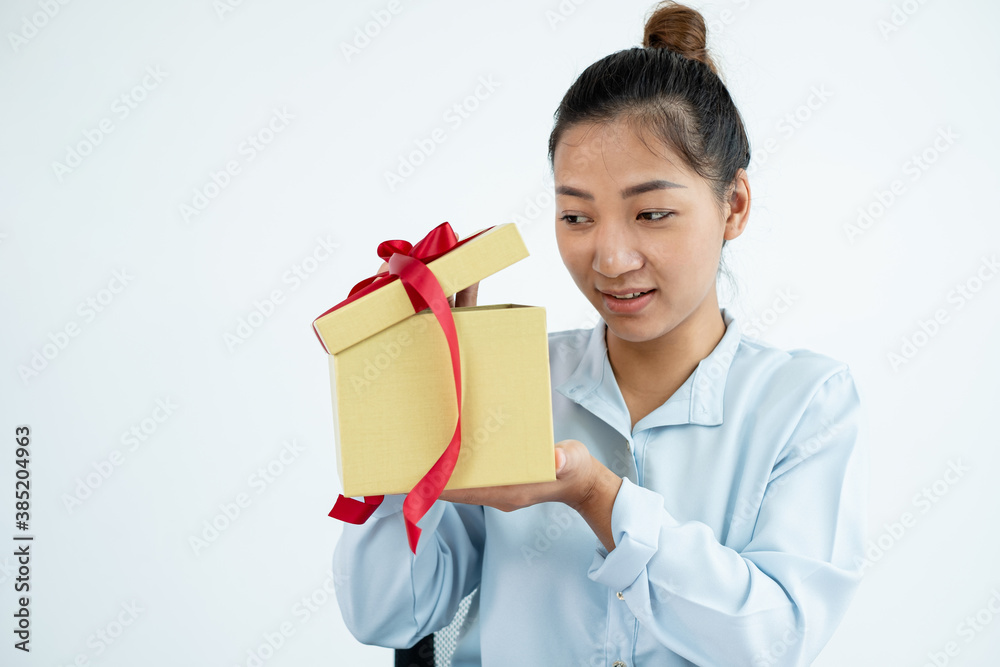 Asian women happy to open surprise boxes are stunned with excitement, joy, and smile on holidays, Christmas, birthday, or Valentine's Day concept Asian women happy to open surprise boxes are stunned with excitement, joy, and smile on holidays, Christmas, birthday, or Valentine's Day concept