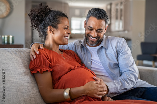 Happy mixed race couple expecting baby photo