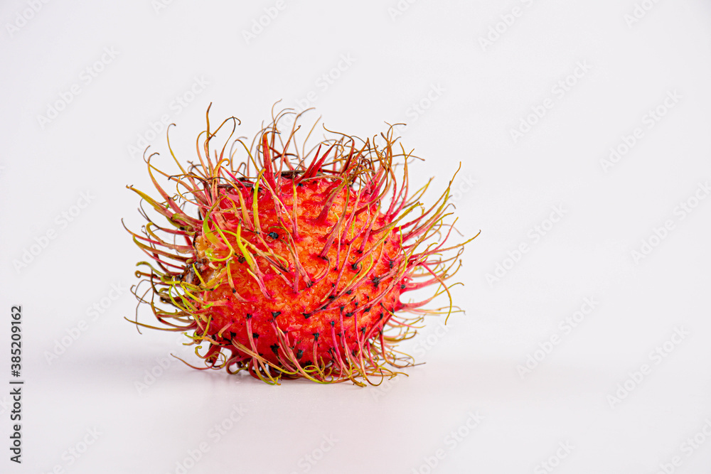 Naklejka premium one rambutan sweet delicious fruit isolated on white background
