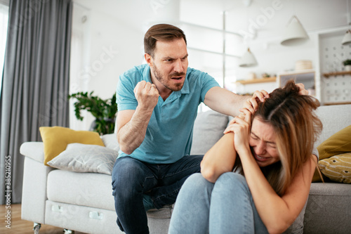 Violence in family. Husband beating his wife.