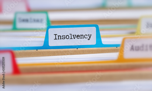 File folders with a tab labeled Insolvency