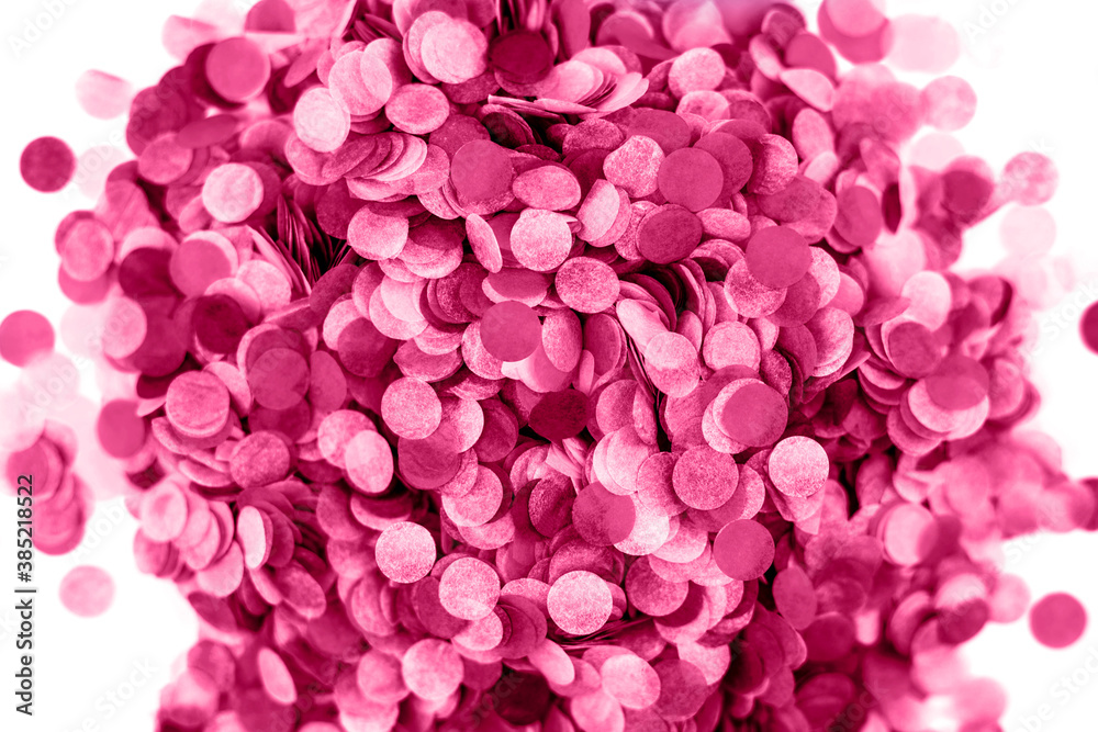 Heap of red confetti isolated on white.