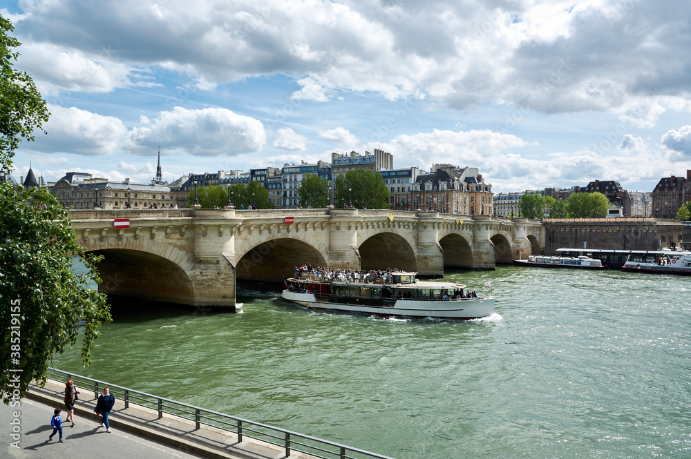 embankments and bridges of the Seine in Paris with boats and barges